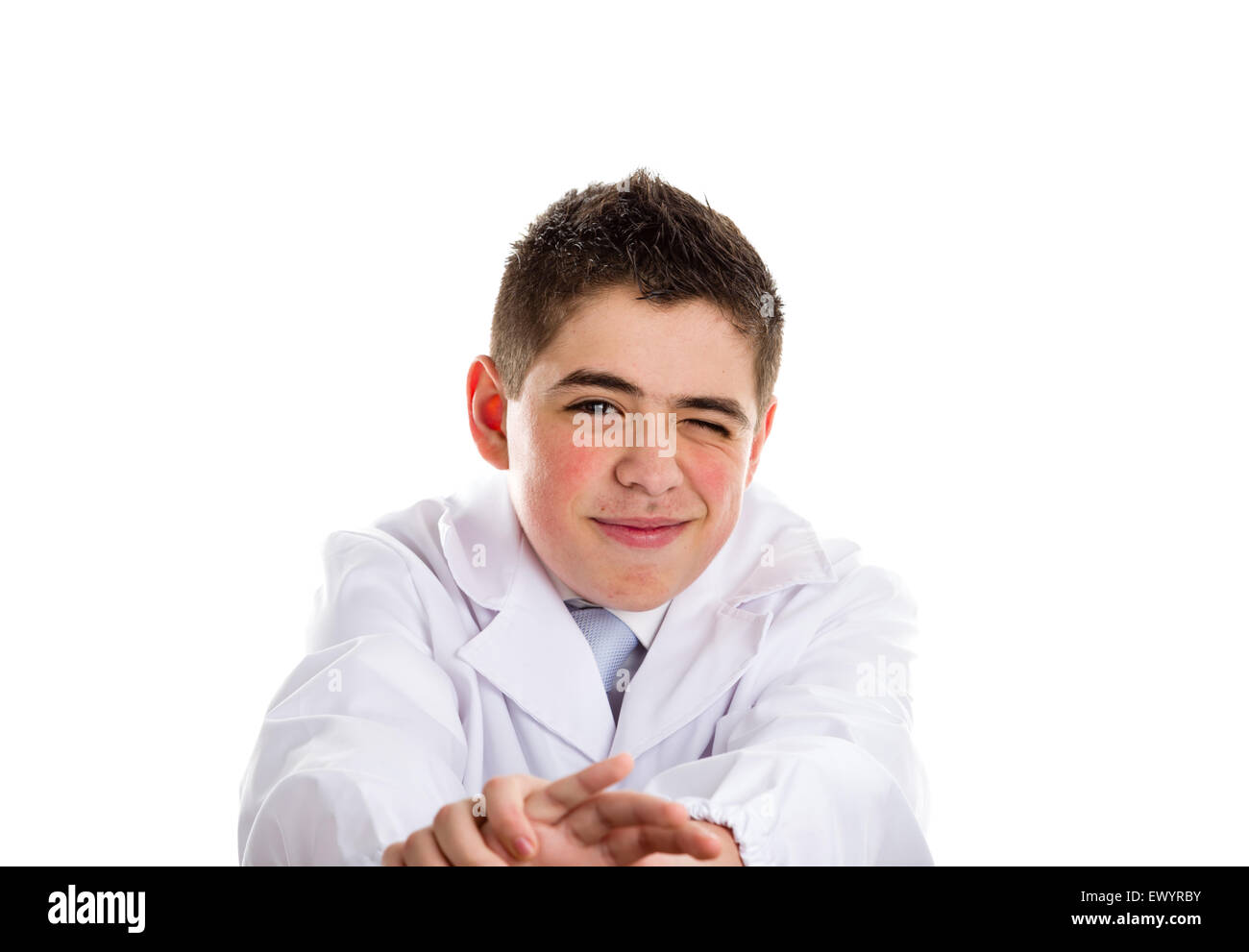 A boy doctor in white coat and blue tie helps to feel medicine more friendly: he is stretching his arms.. His acne skin has not ben retouched Stock Photo