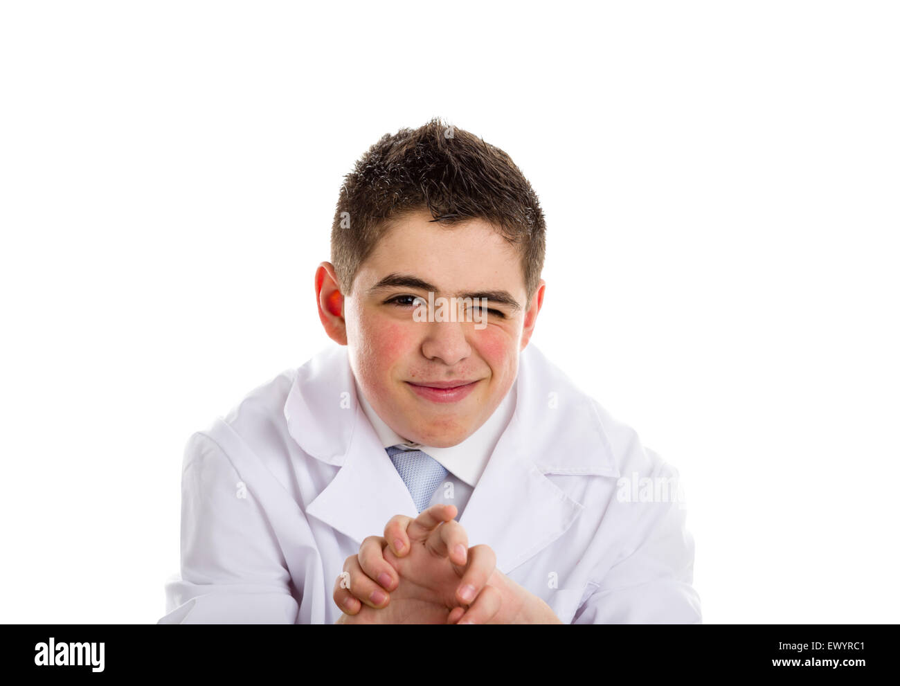 A boy doctor in white coat and blue tie helps to feel medicine more friendly: he is stretching his arms.. His acne skin has not ben retouched Stock Photo