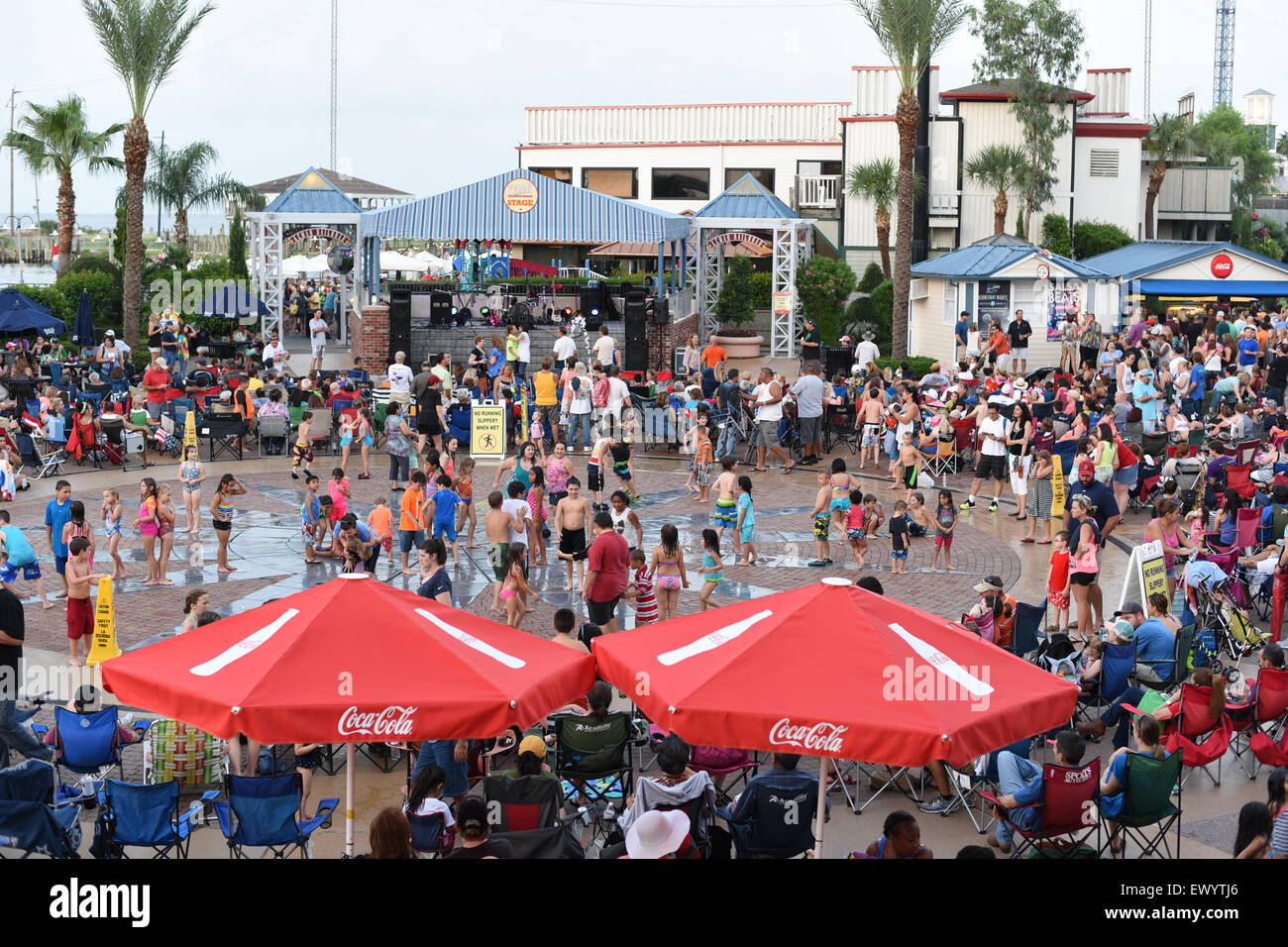 Crowd gathered at a splash pad in Kemah, Texas boardwalk Stock Photo