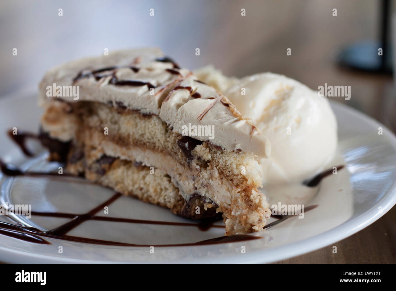 A Slice Of Tiramisu Cake With Ice Cream Stock Photo Alamy