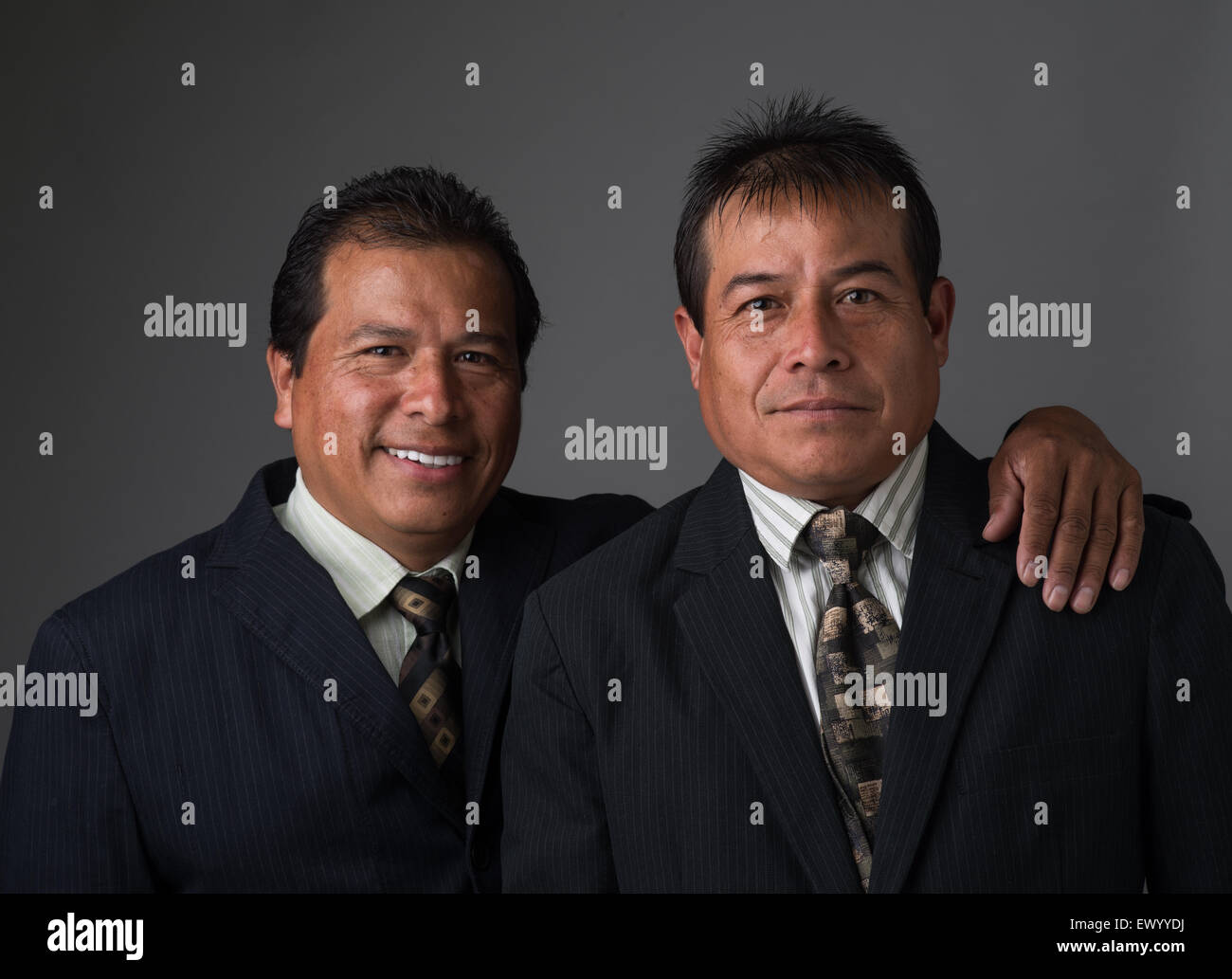 Hispanic business men smiling portrait Stock Photo