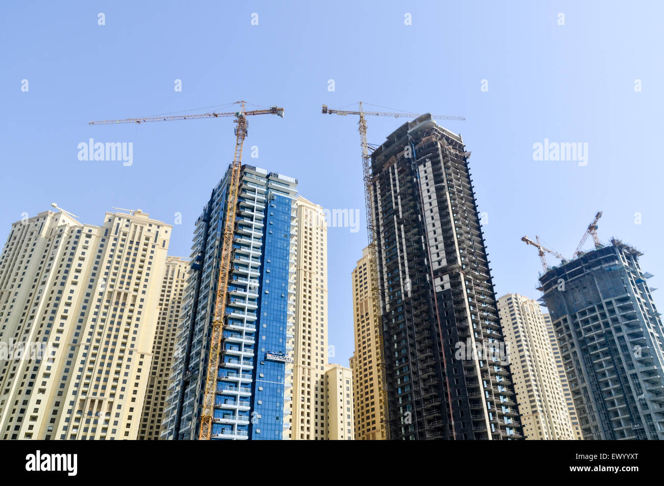 Cranes and construction of modern high rise buildings, towers and hotels of the Dubai Marina, United Arab Emirates Stock Photo