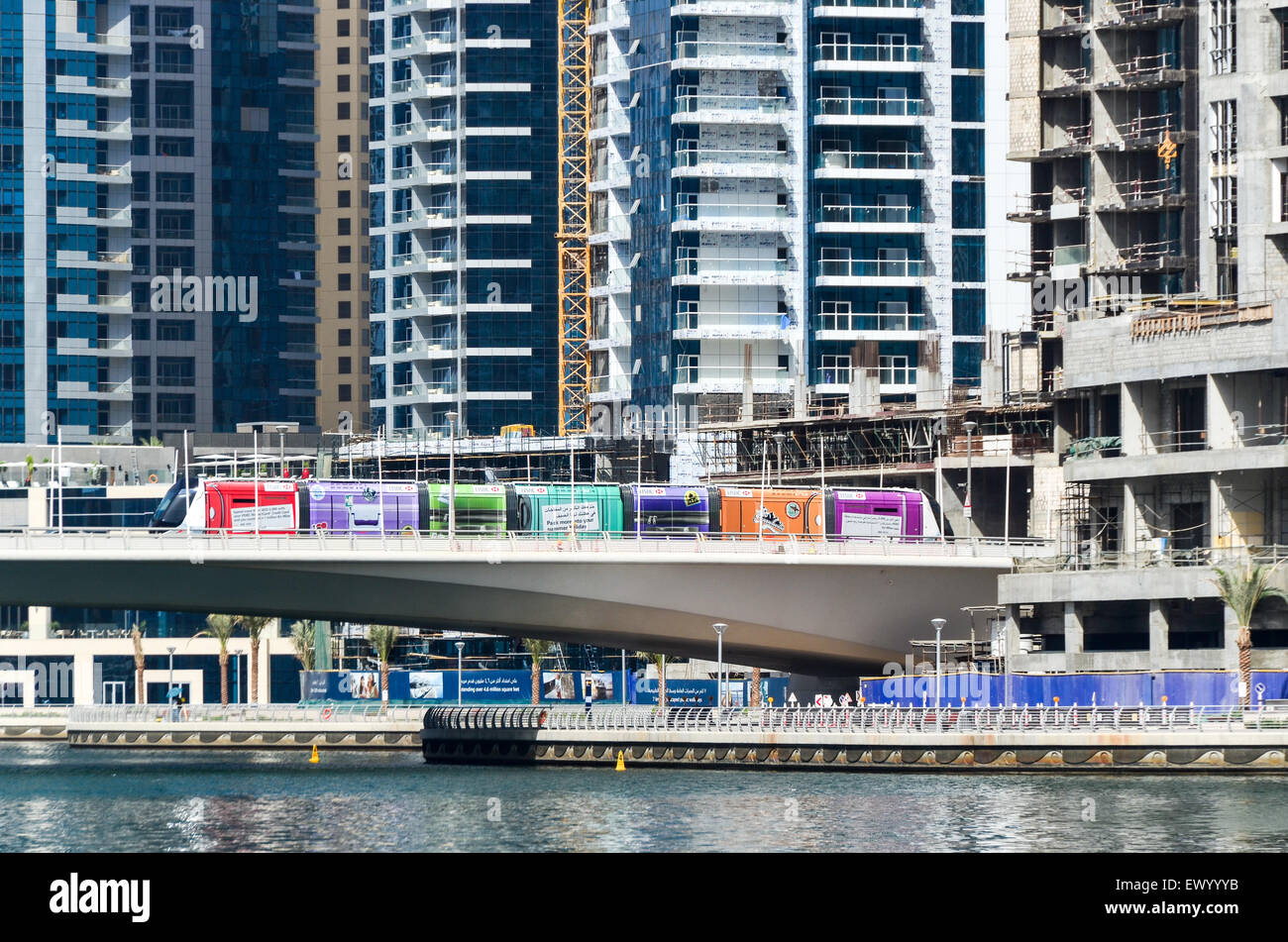Tramway on a bridge among high rise buildings, towers and hotels of the Dubai Marina, United Arab Emirates Stock Photo