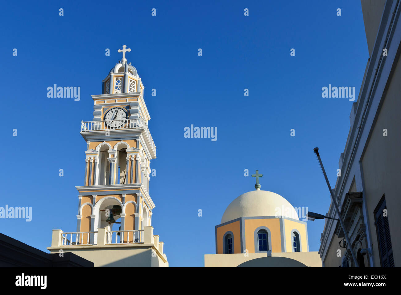 The clock tower of Saint John the Baptist Cathedral in Fira, Santorini ...