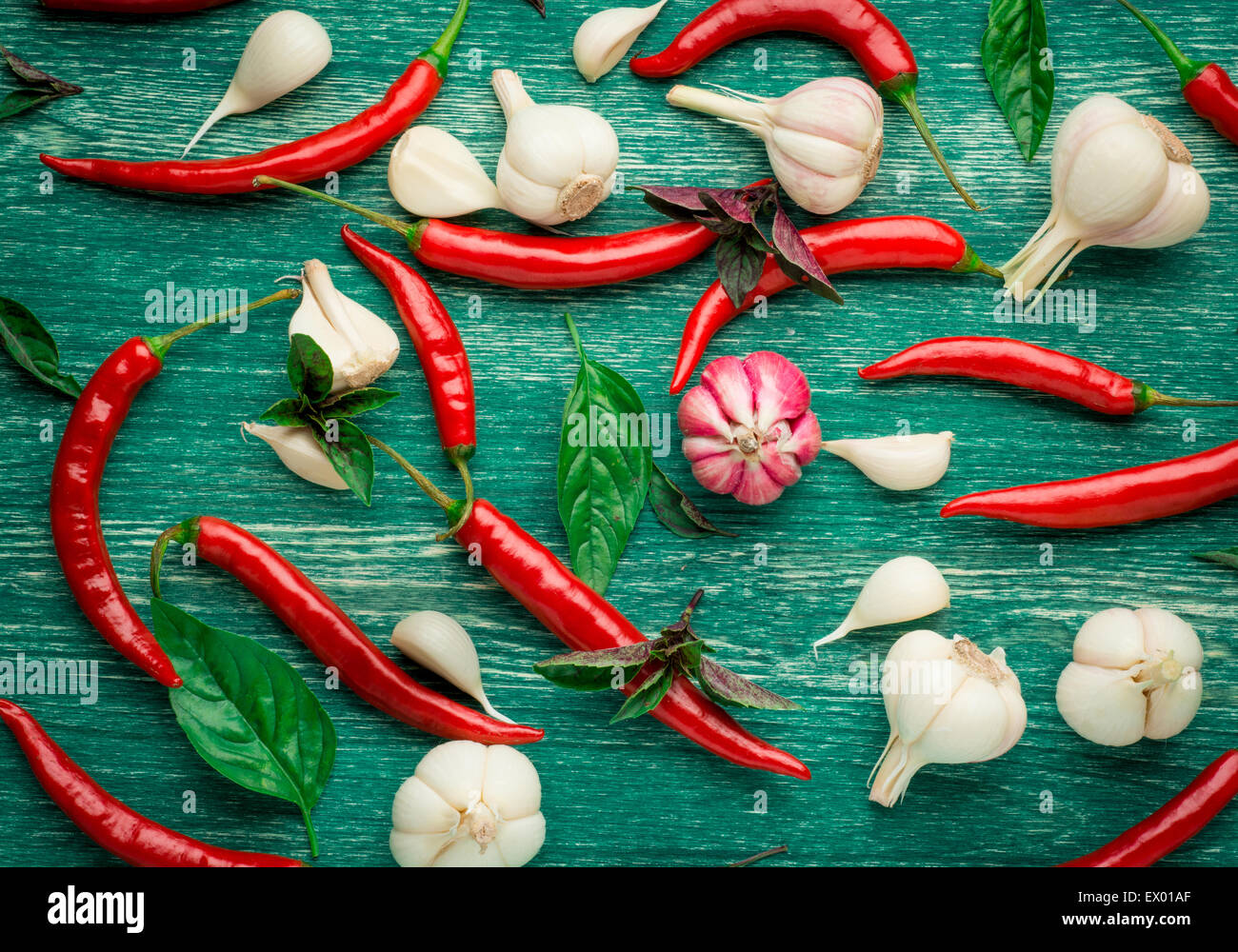 Red hot chili peppers with spice ingredients over wooden background Stock Photo Alamy