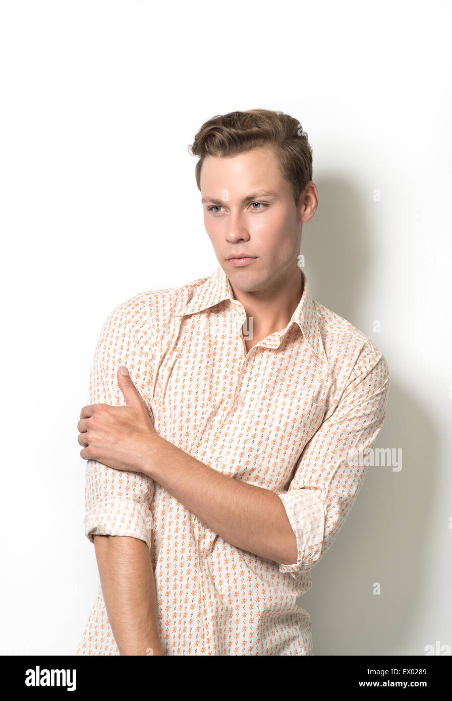 A handsome man, male model posing crossing his arm Stock Photo