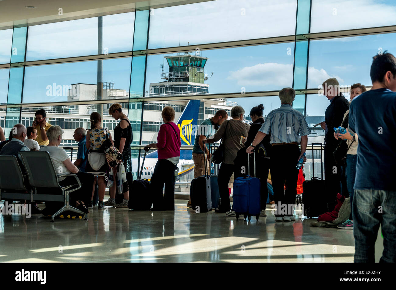 Passengers queue to board a Ryanair flight at Dublin airport, Ireland Stock Photo
