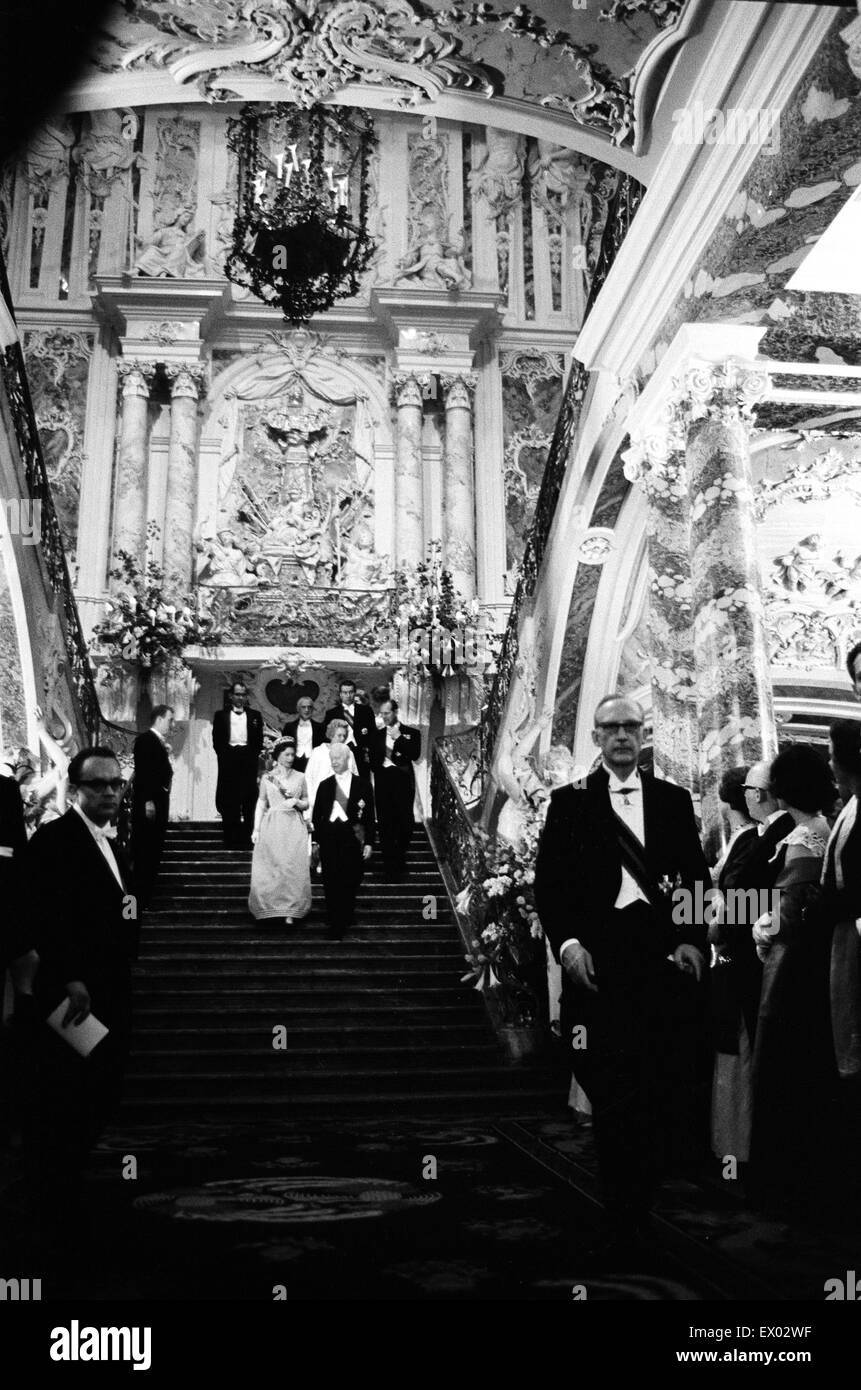 Queen Elizabeth II leading a procession down the fantastic staircase of Augustusburg Palace in Bruhl, during her visit to West Germany. 18th May 1965. Stock Photo