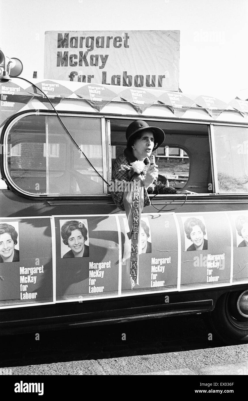 Labour MP Margaret McKay has bought an ice cream van from which to canvass her constituency. She is seen here in the Clapham Park area of London in her converted van with some of her supporters. Their slogan is 'Stop me and Ask one' 18th March 1966 Stock Photo