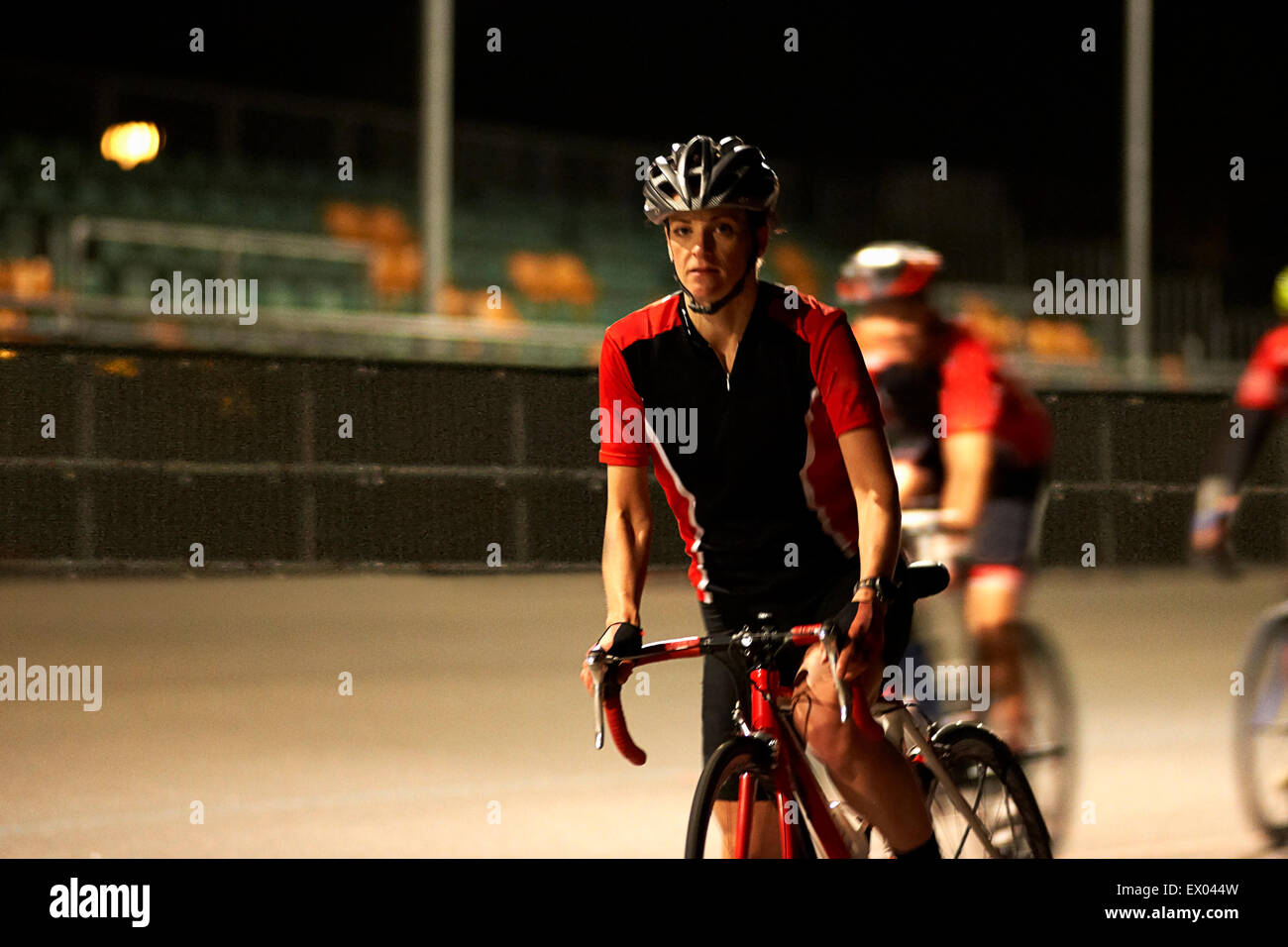 Cyclists cycling on track at velodrome Stock Photo