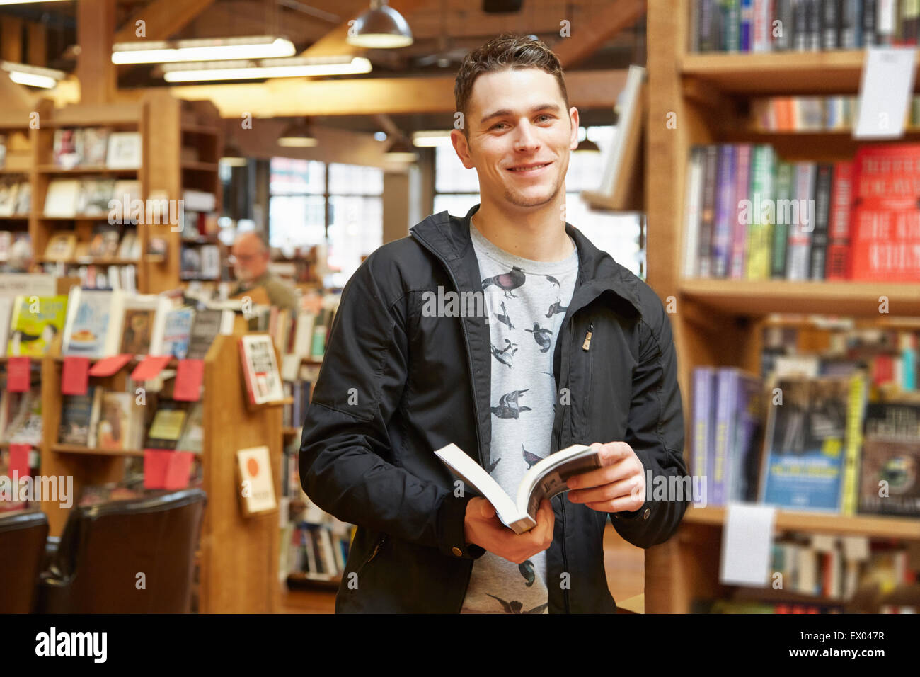 Portrait of young man in book store Stock Photo