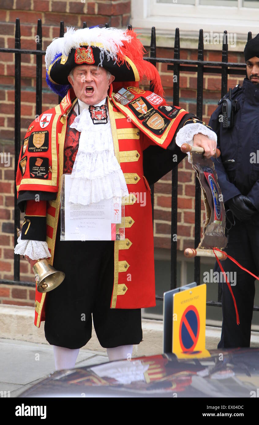 The town crier announces the birth of the new royal baby outside St