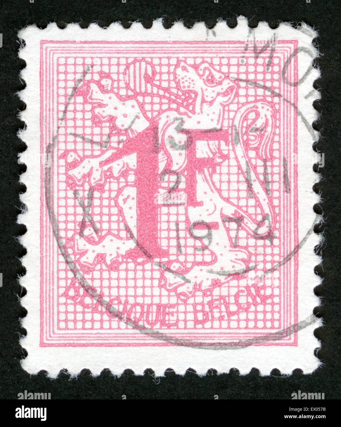 BELGIUM - CIRCA 1951:A stamp printed in Belgium shows image of The coat of arms of the Kingdom of Belgium bears a lion or Leo Be Stock Photo