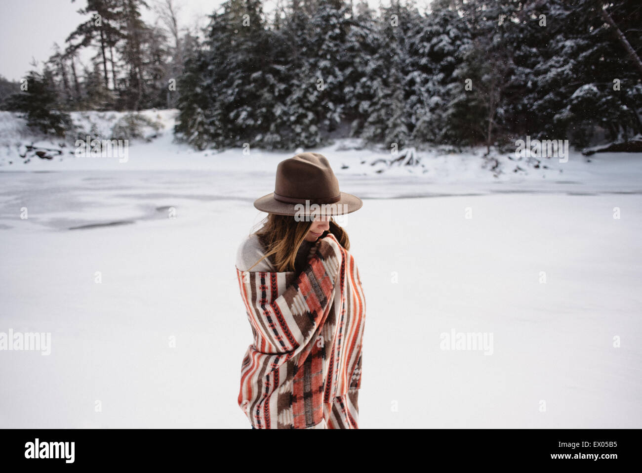 Portrait Of Woman Wrapped In Blanket In Snow Covered Landscape Stock Photo Alamy