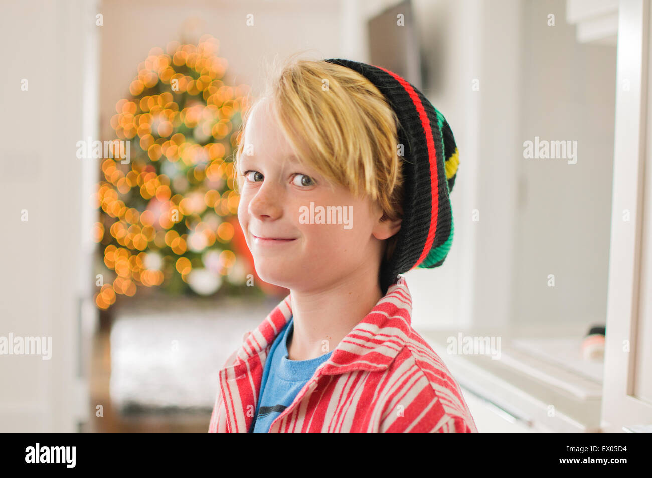 Portrait of boy wearing knit hat looking sideways Stock Photo