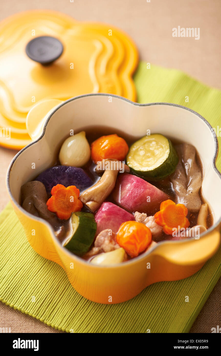Stewed dish in cast iron cookware Stock Photo