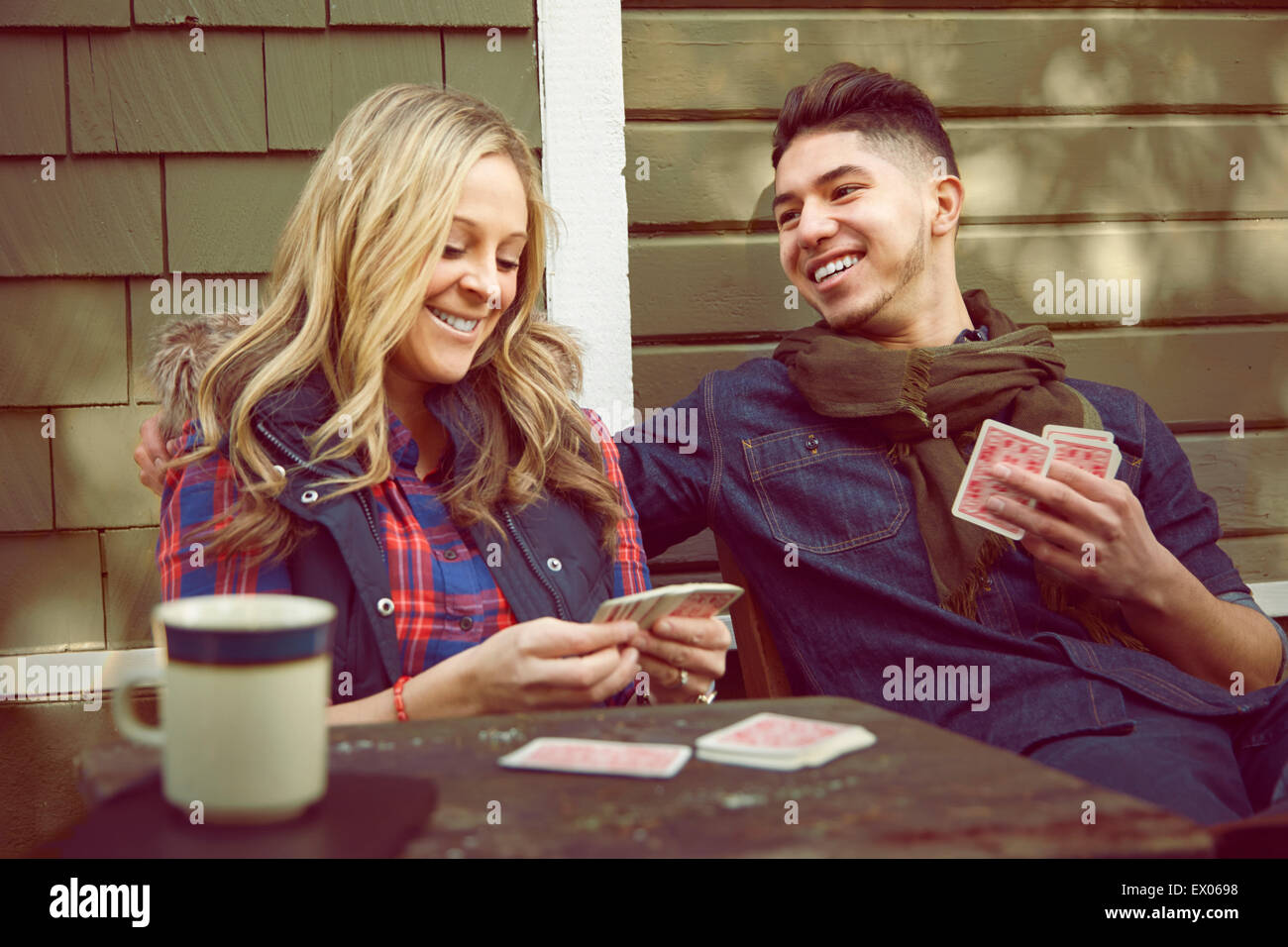 Young couple playing cards Stock Photo