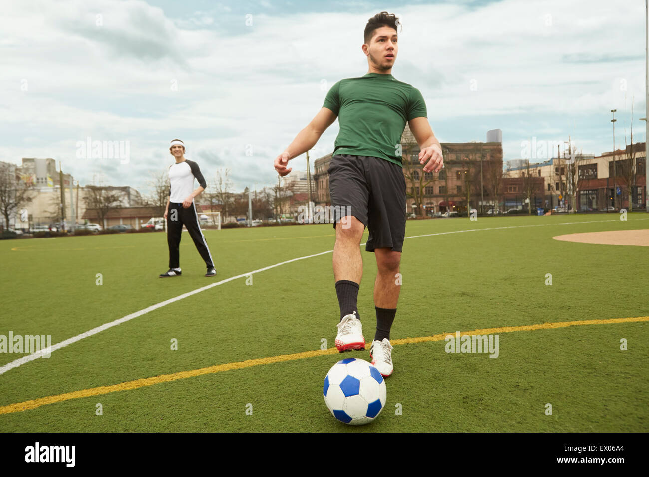 Young male soccer player preparing to take a corner shot Stock Photo