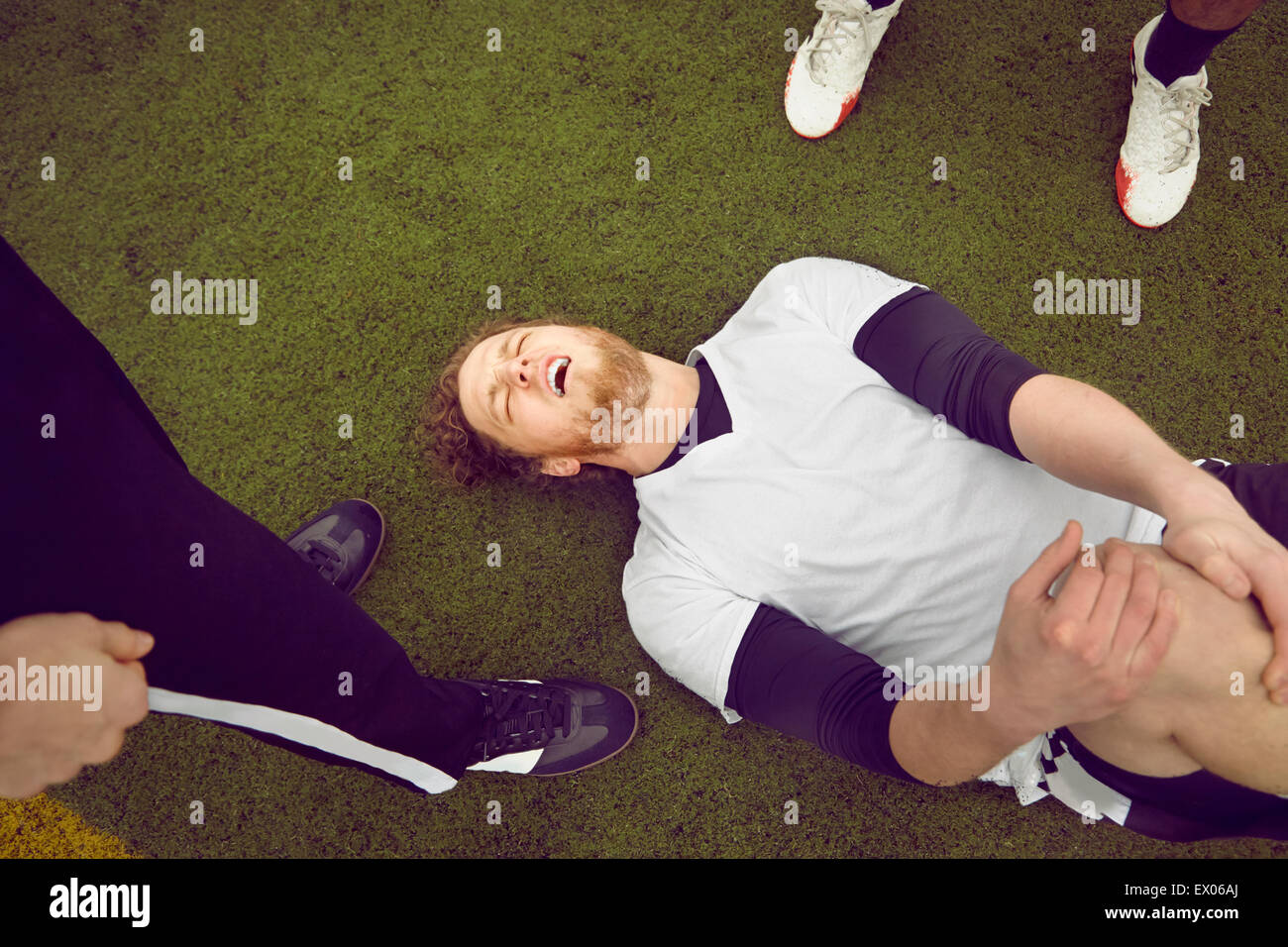 Injured male soccer player on soccer pitch Stock Photo Alamy