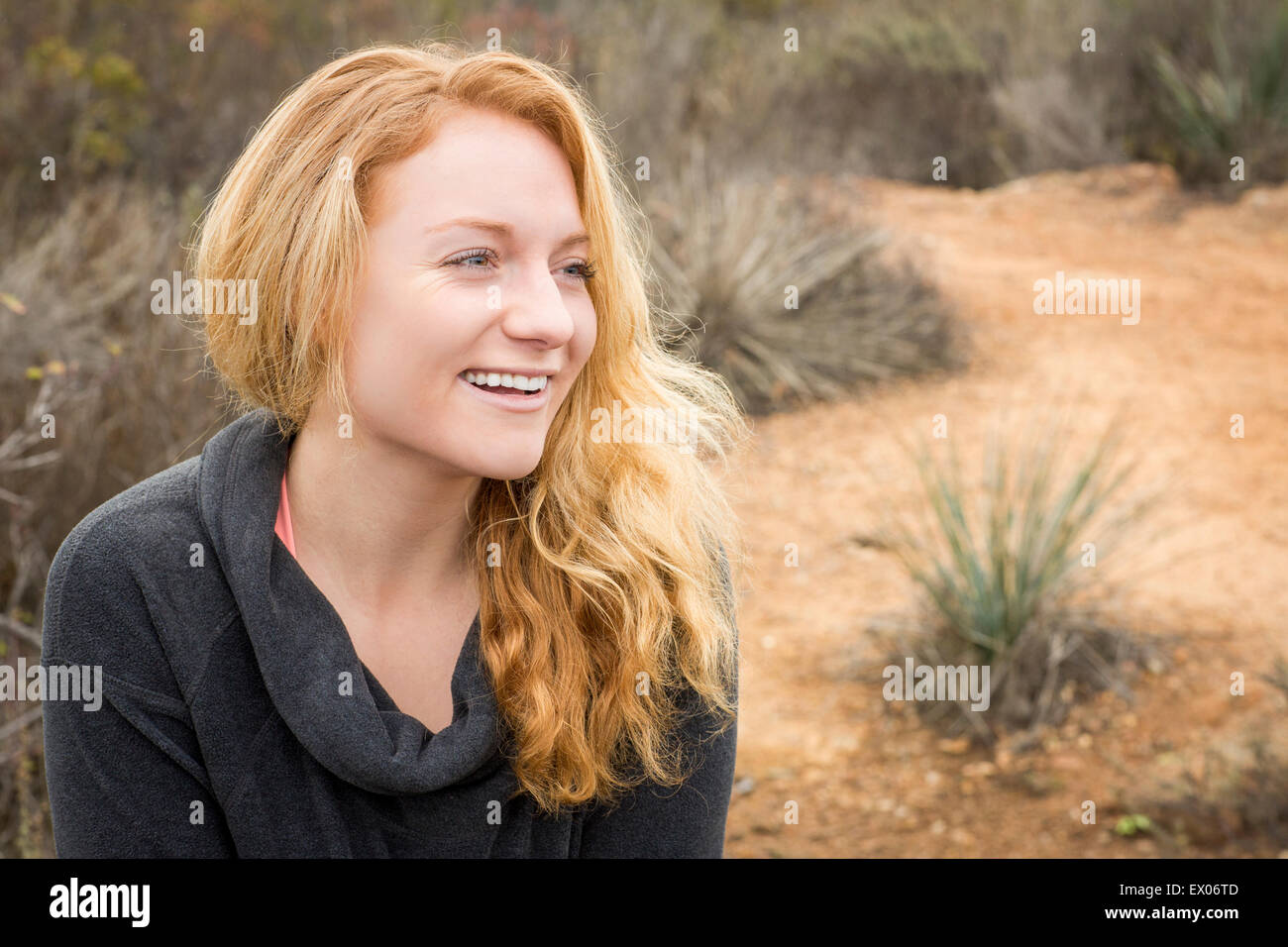Portrait of young female hiker in landscape Stock Photo