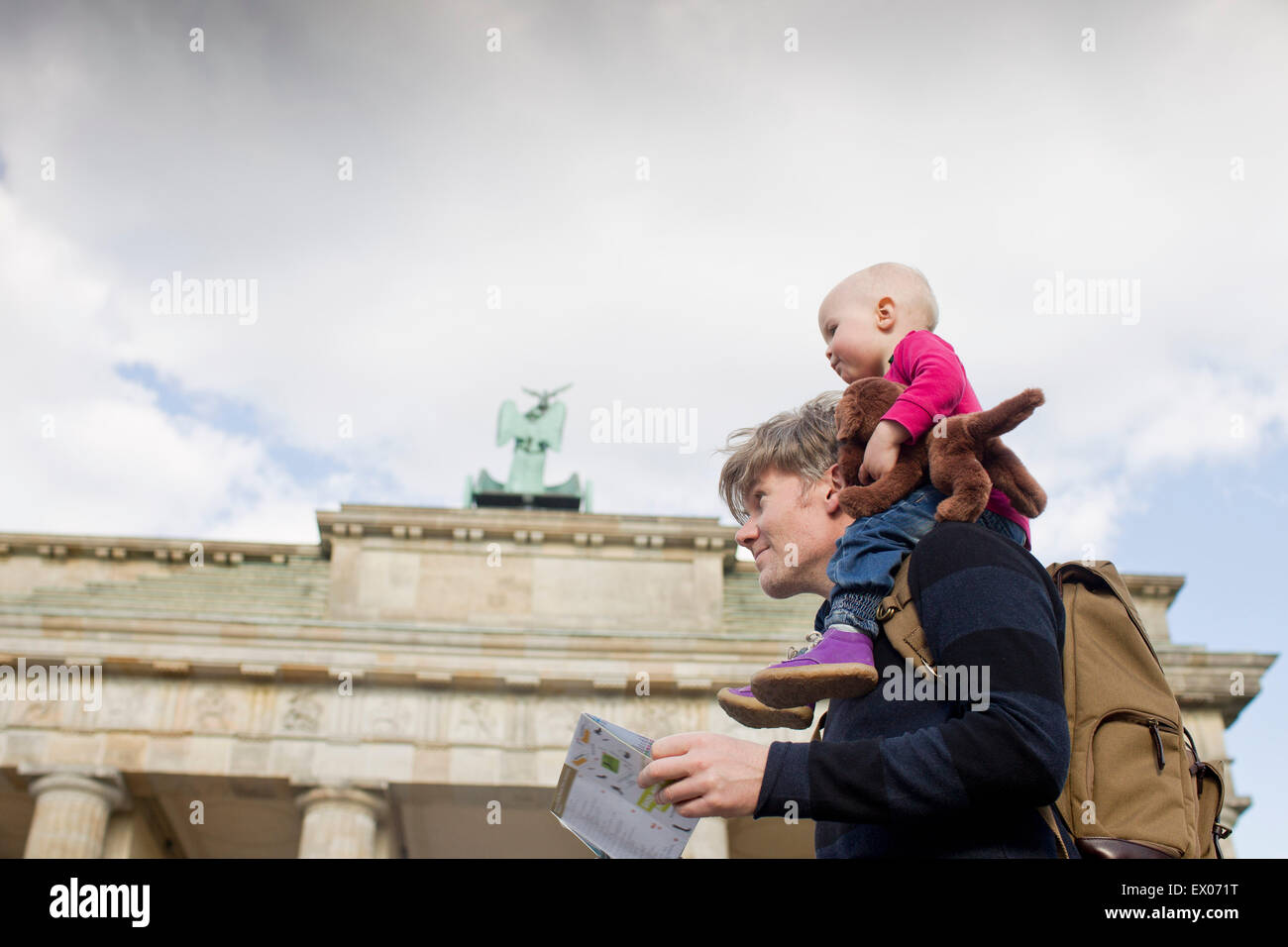 Father sightseeing whilst giving baby daughter shoulder ride, Brandenburg Gate, Berlin, Germany Stock Photo