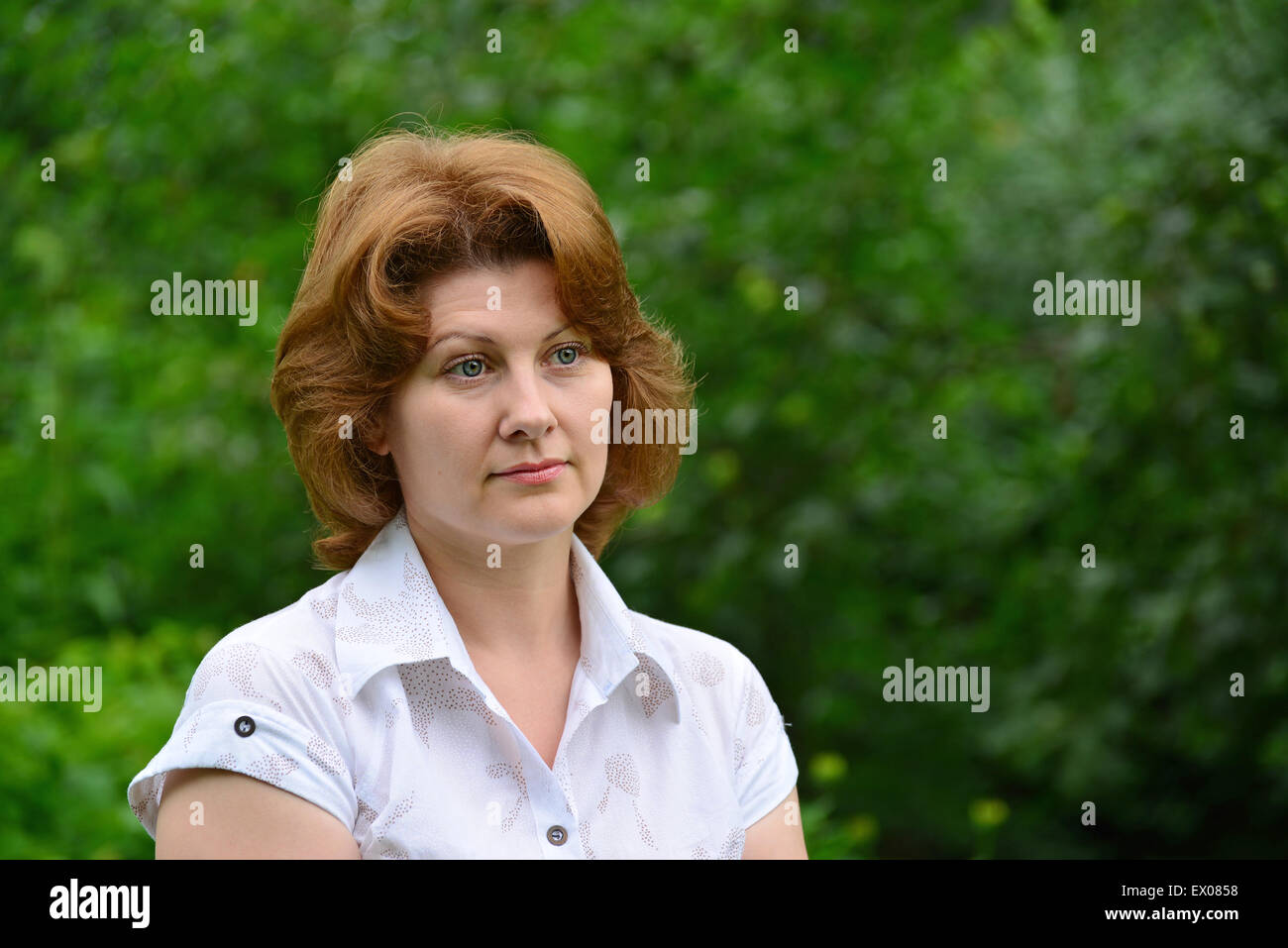 Portrait of a woman on the nature in the summer Stock Photo