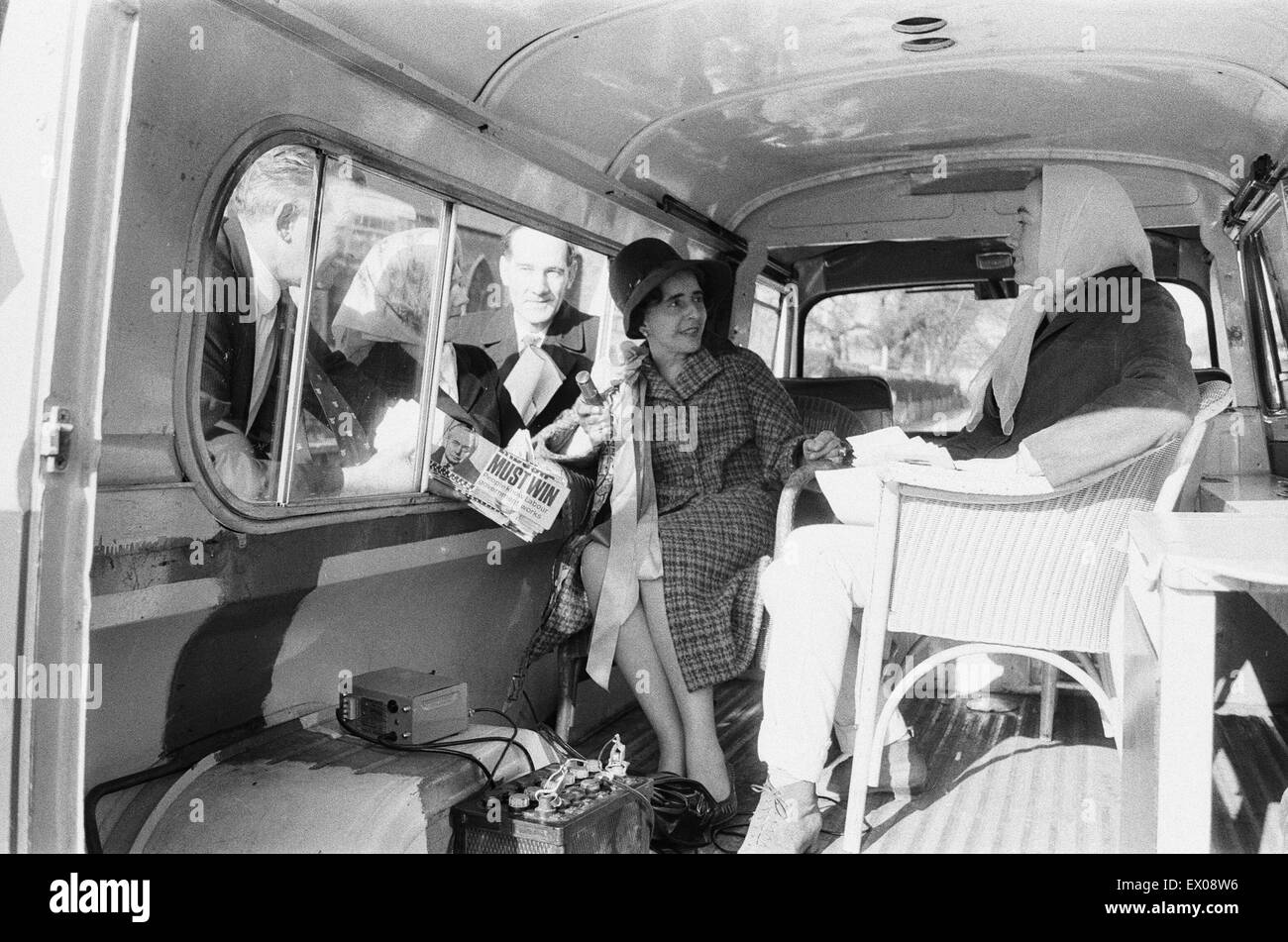 Labour MP Margaret McKay has bought an ice cream van from which to canvass her constituency. She is seen here in the Clapham Park area of London in her converted van with some of her supporters. Their slogan is 'Stop me and Ask one' 18th March 1966 Stock Photo