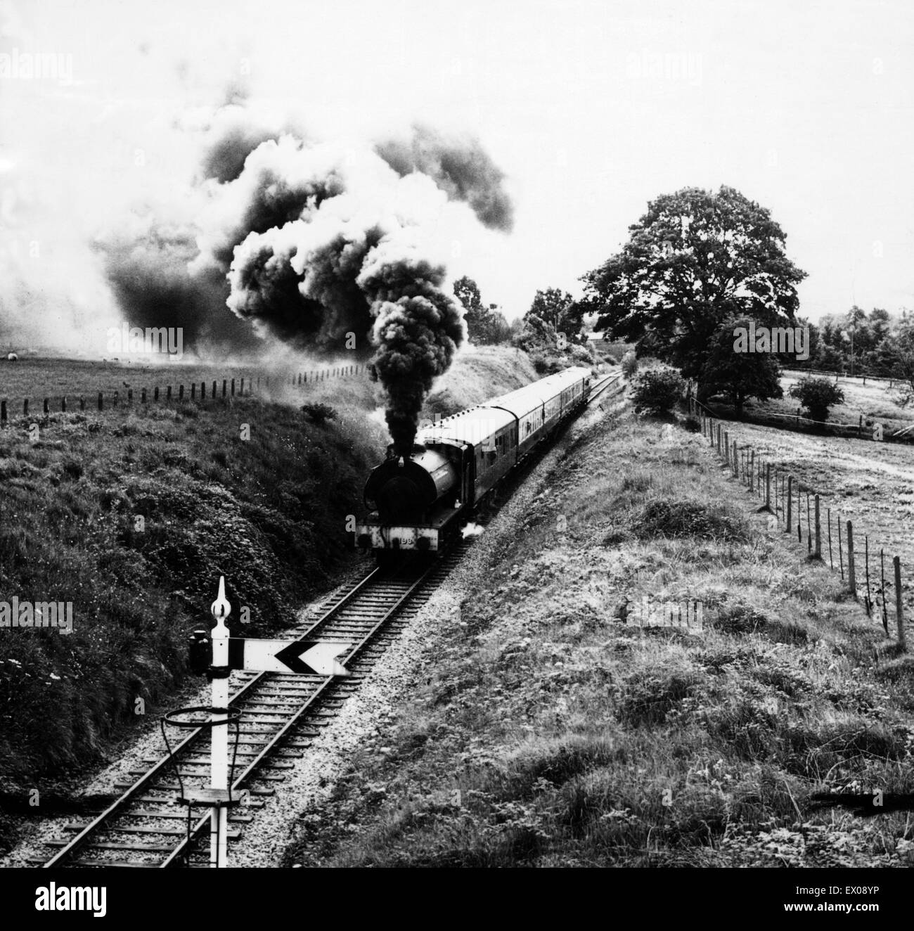A steam train of the Severn Valley Railway rolls through the Shropshire countryside between Bridgnorth and Hampton Loade, Shropshire, England, 22nd August 1973. Severn Valley Railway Line. Stock Photo