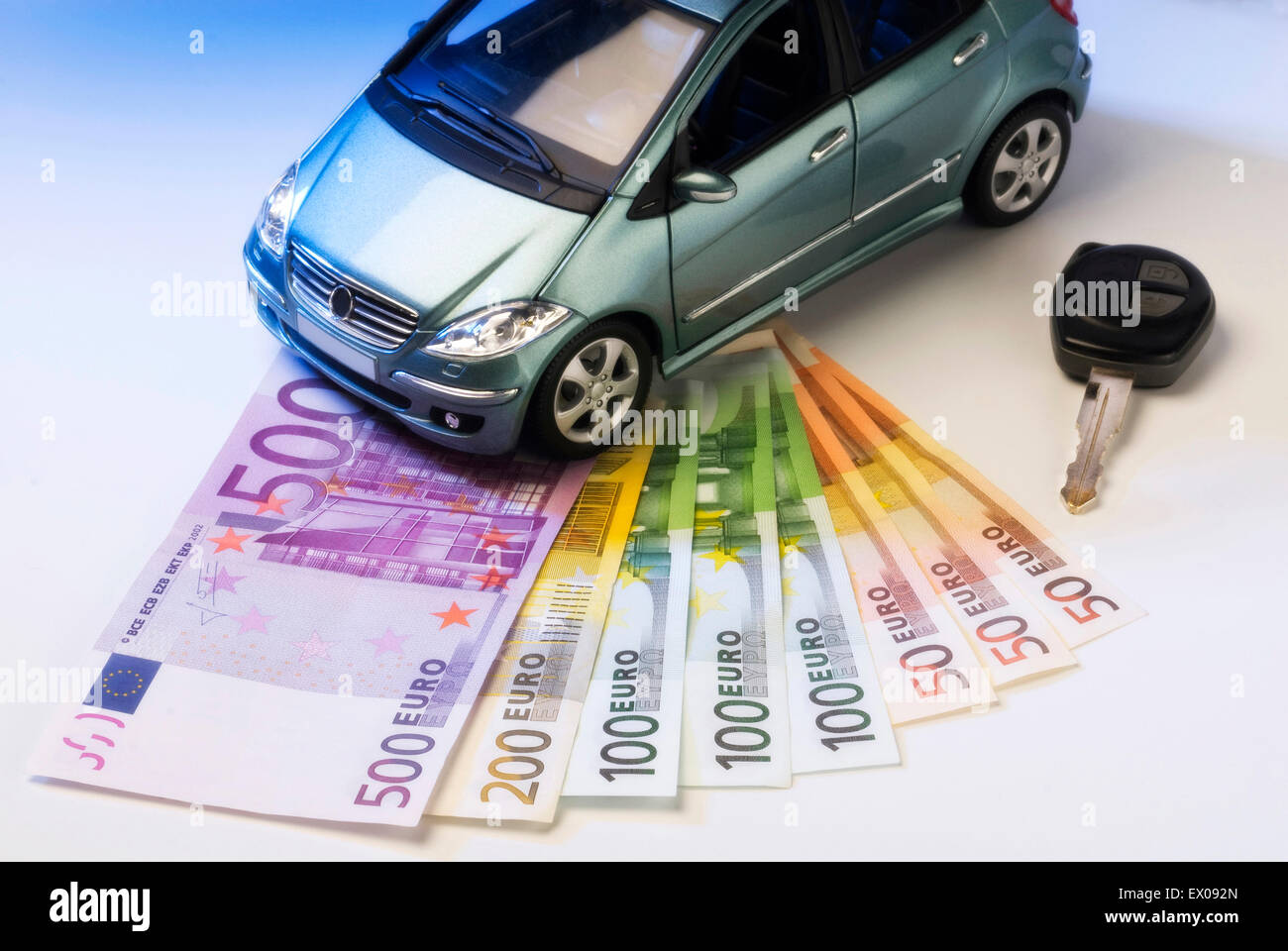 Car with key and bank notes Stock Photo