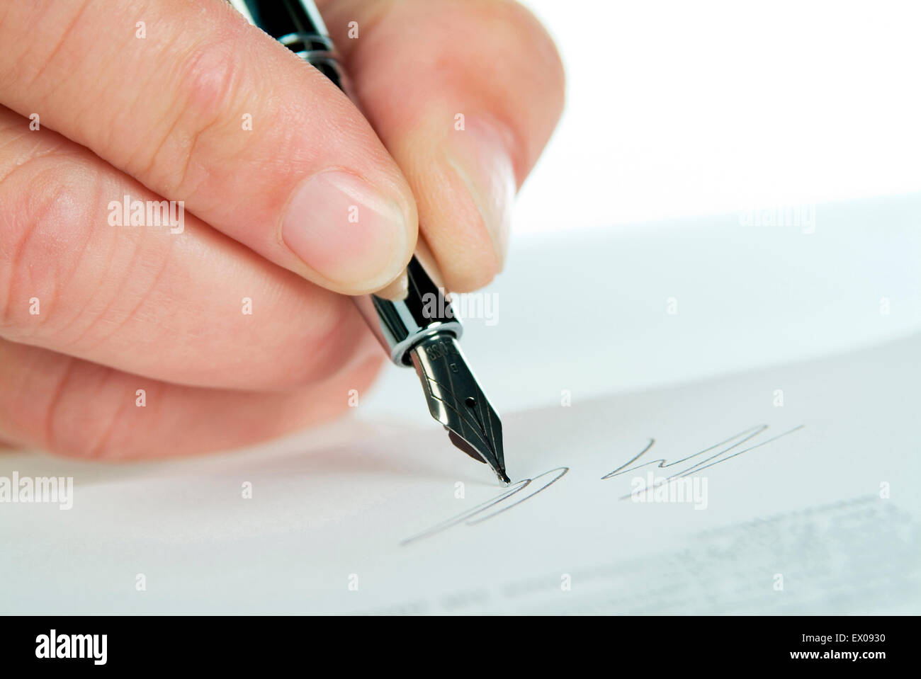 Signing a contract as close up. Stock Photo