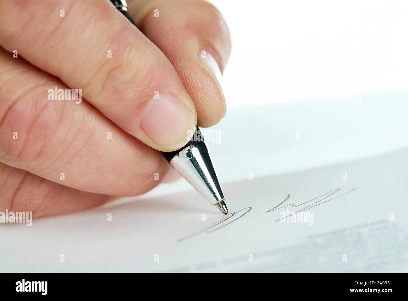 Signing a contract as close up. Stock Photo