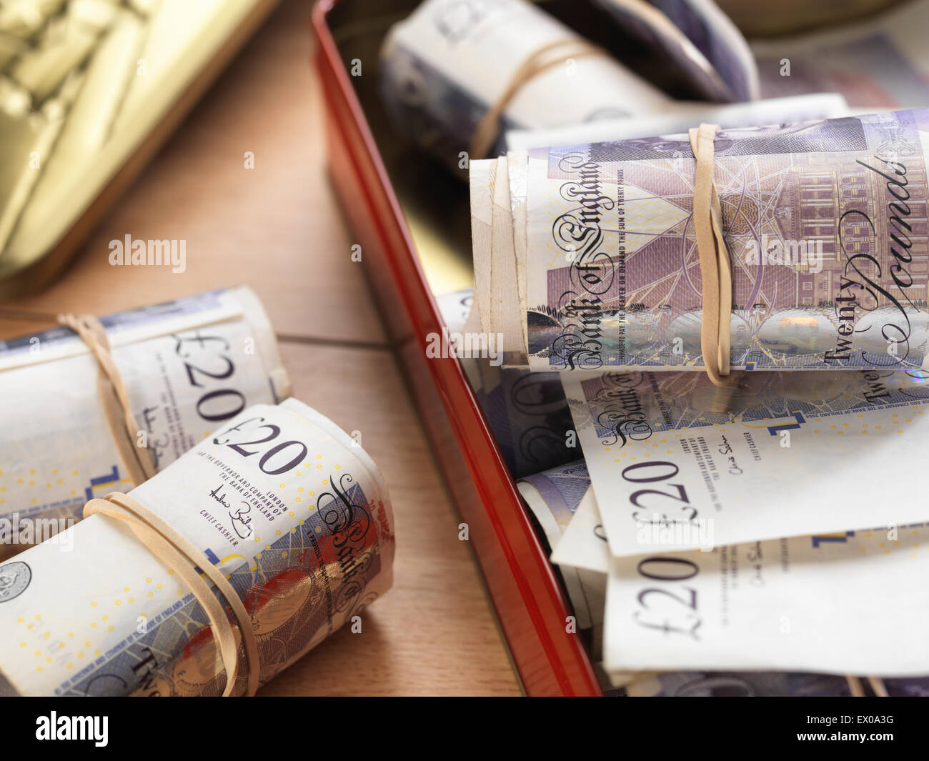 Cash savings in biscuit tin Stock Photo