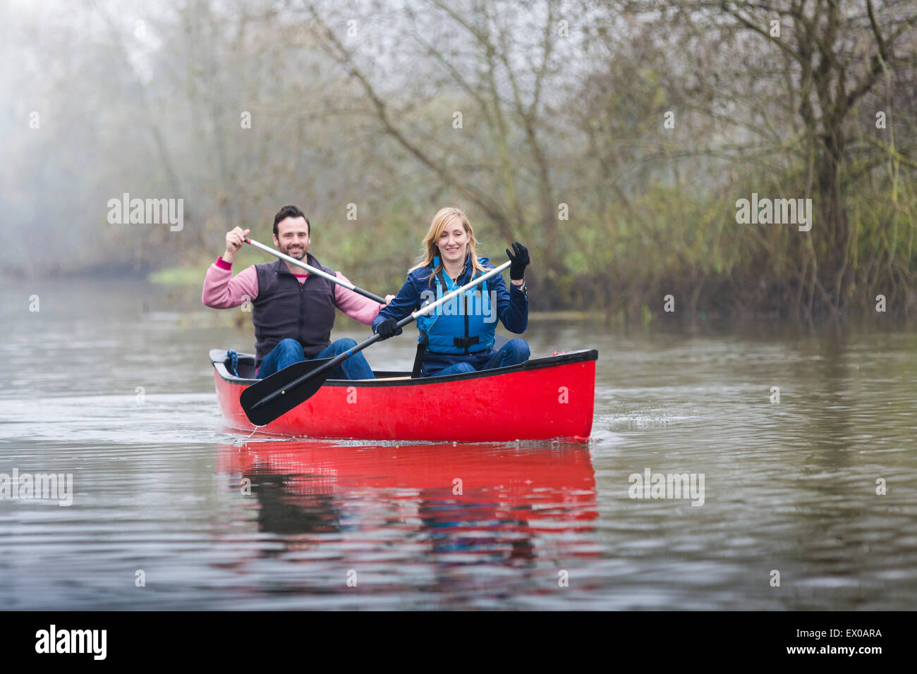 Couple canoeing Stock Photo