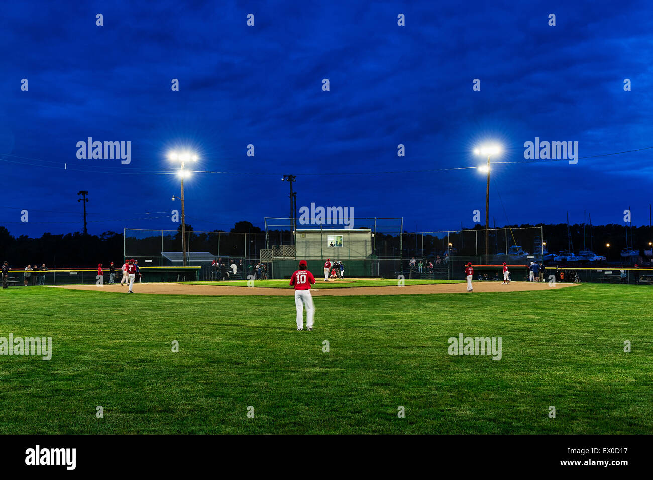 Little League baseball game at night Stock Photo Alamy
