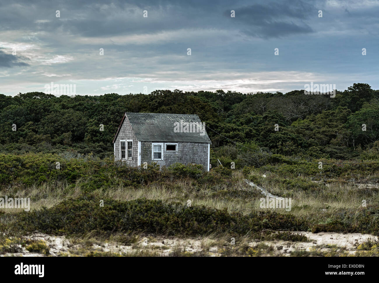 A Remote Coastal Cottage Weathered By Wind And Sea Salt Stock