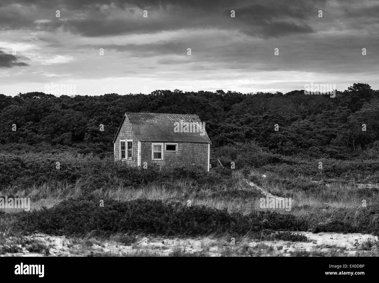 A remote coastal cottage weathered by wind and sea salt. Stock Photo