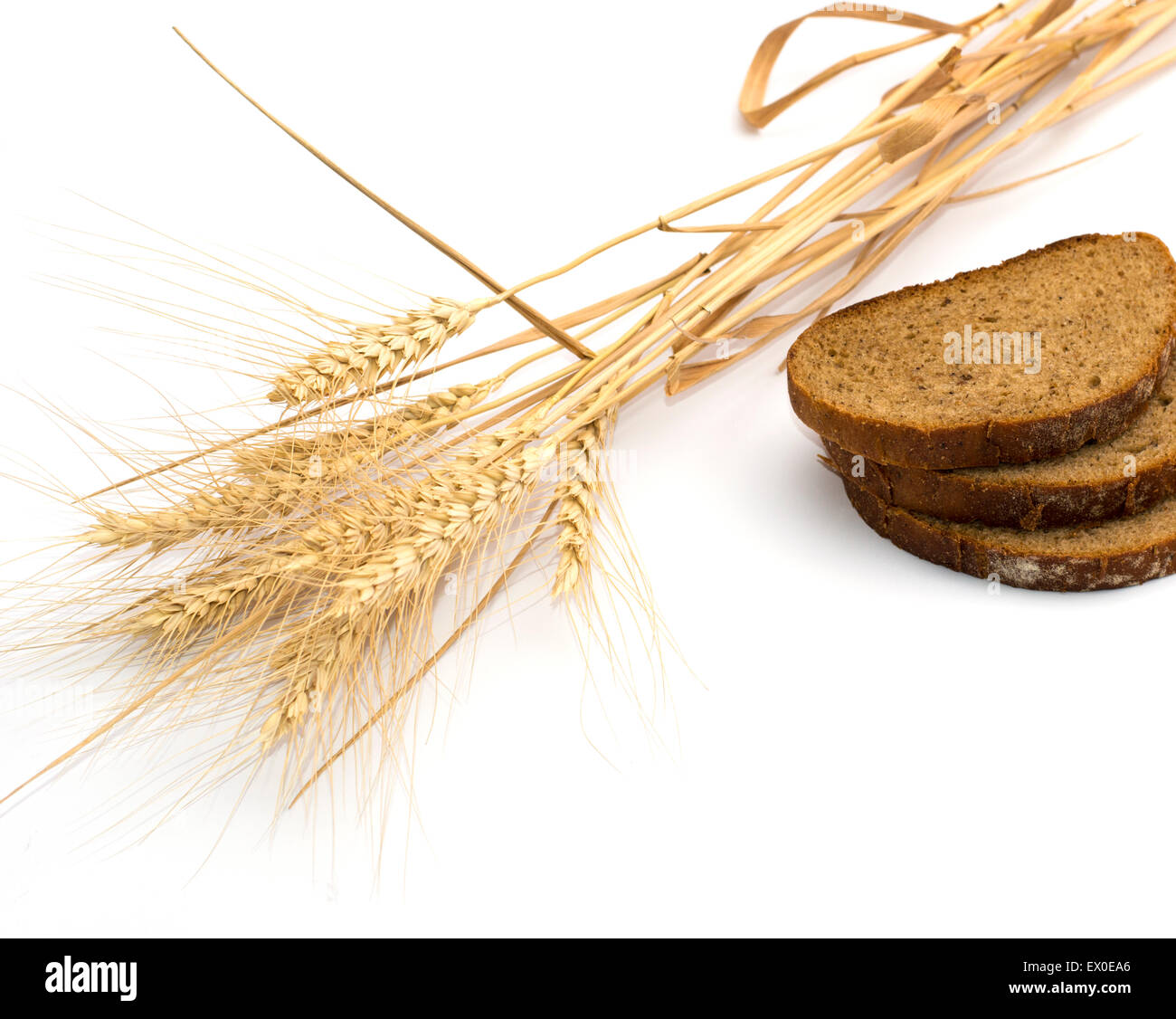 the cut bread and ears of wheat Stock Photo