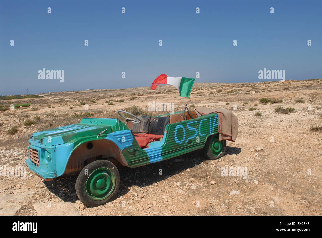 taly, the Lampedusa island, southernmost point of Italy, car wreckage used as insignia of a disco. Stock Photo