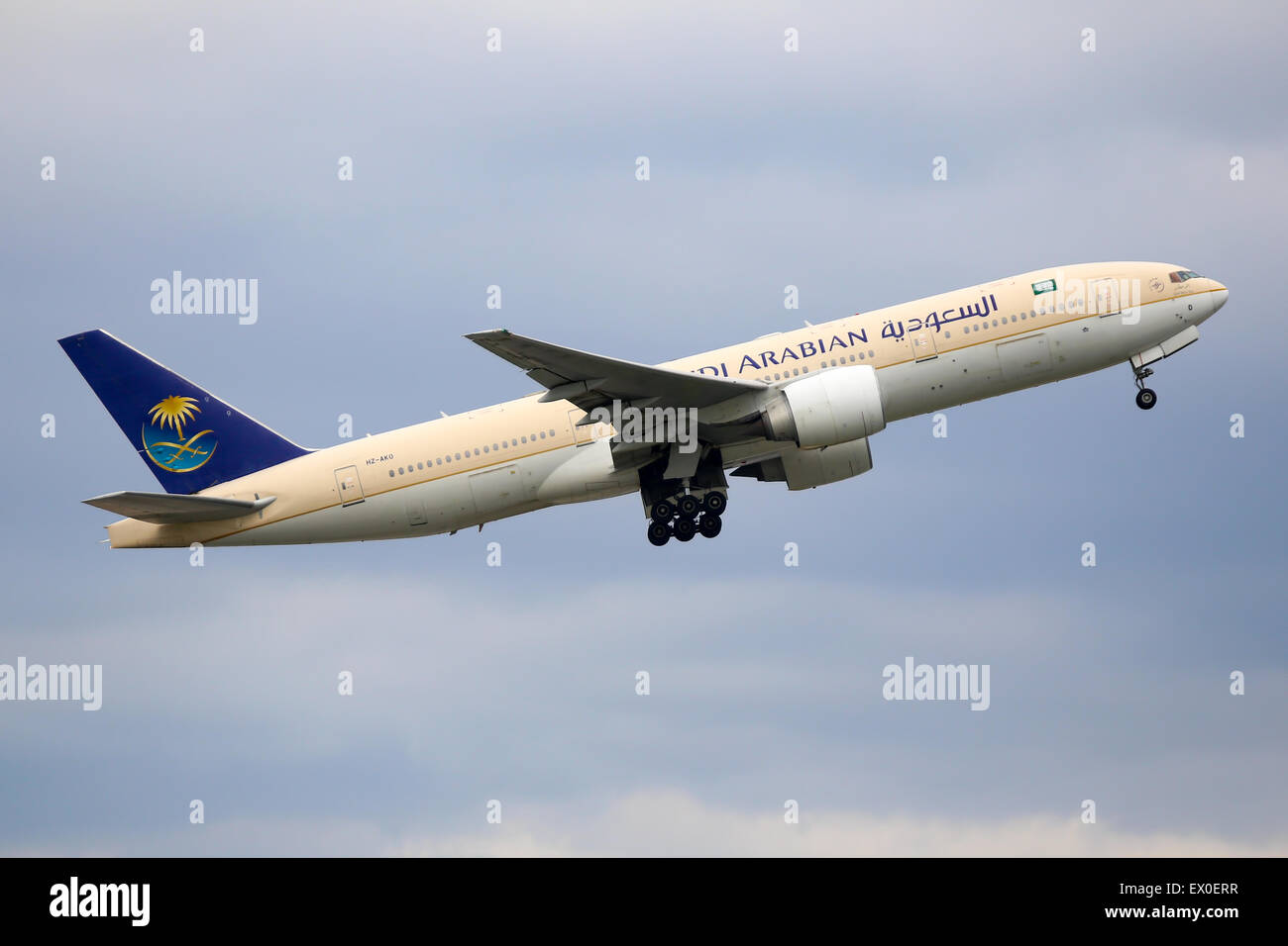 Saudi Arabian Airlines Boeing 777-200 climbs away from runway 05L at Manchester airport. Stock Photo