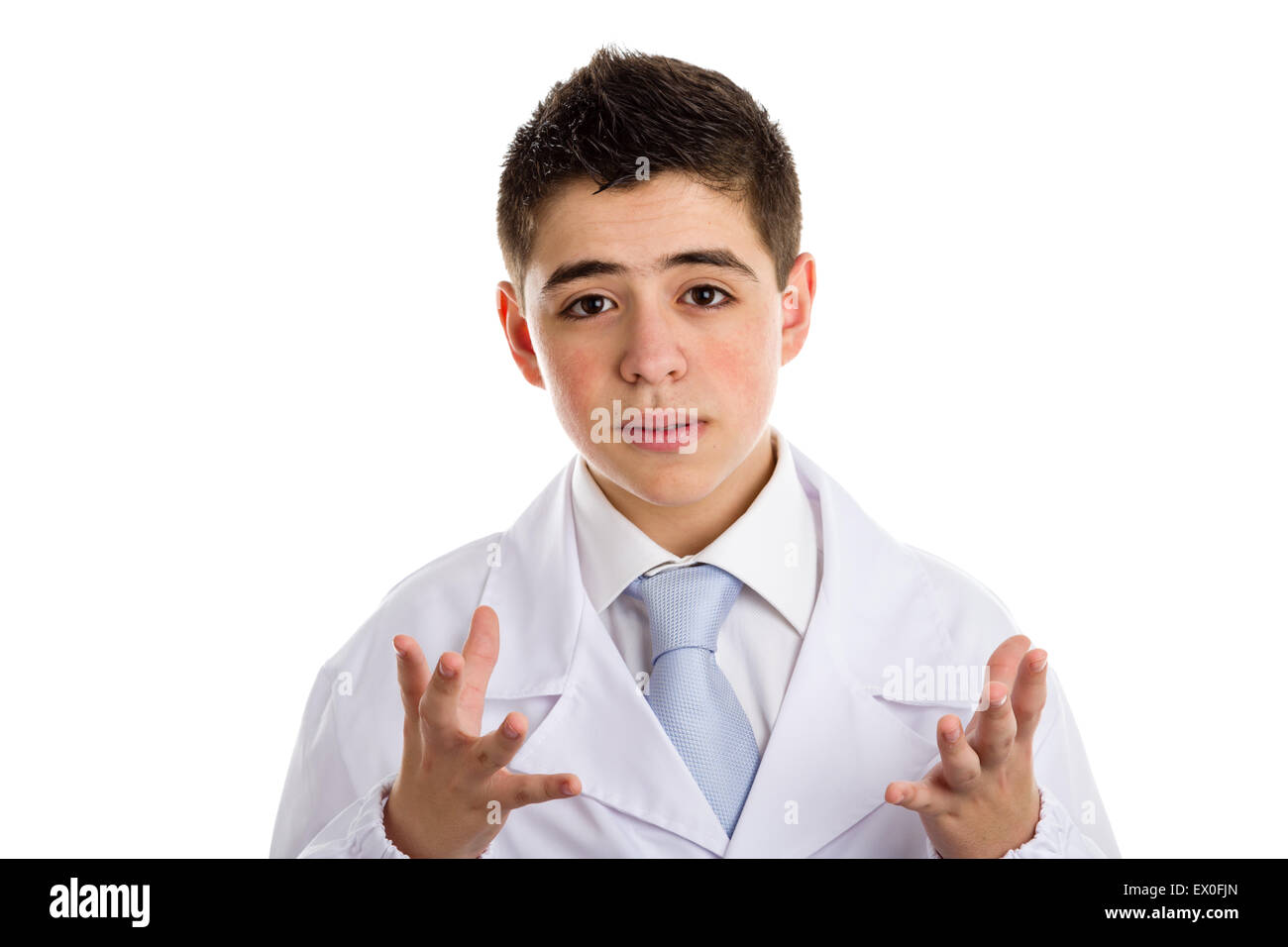 A boy doctor in blue tie and white coat helps to feel medicine more friendly: Palms are facing one another as holding a basketball. His gesture means control of the situation. Stock Photo