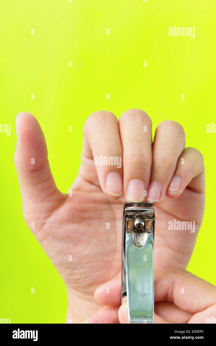 Cutting your fingernails concept Stock Photo