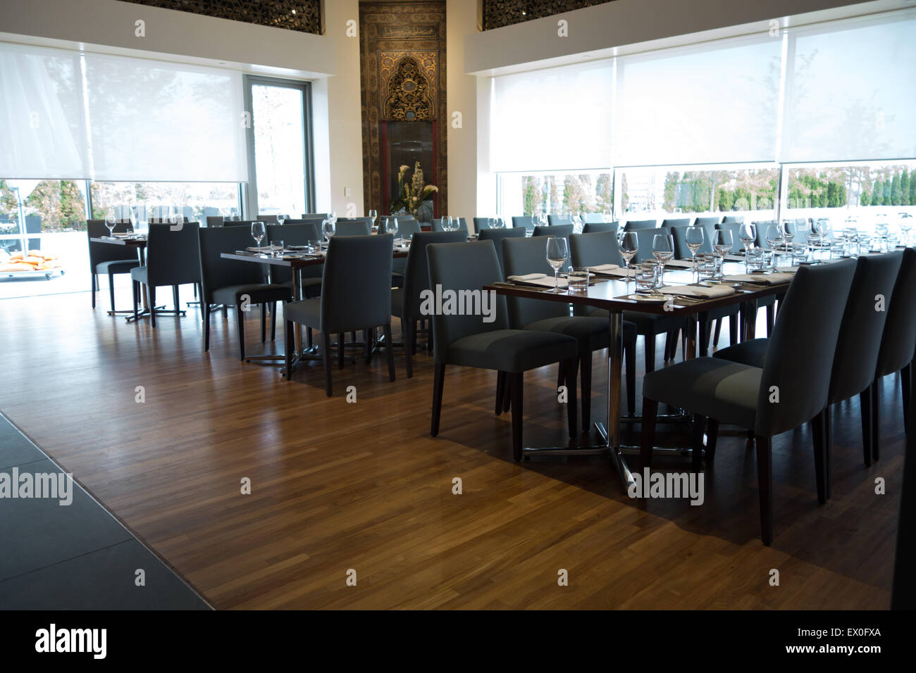 modern empty restaurant long table hardwood floor Stock Photo