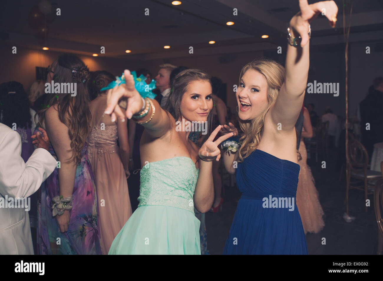 excited young blond white girls dance party Stock Photo