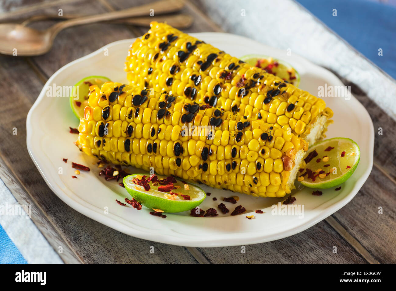 Grilled sweetcorn with lime and chilli flakes Stock Photo
