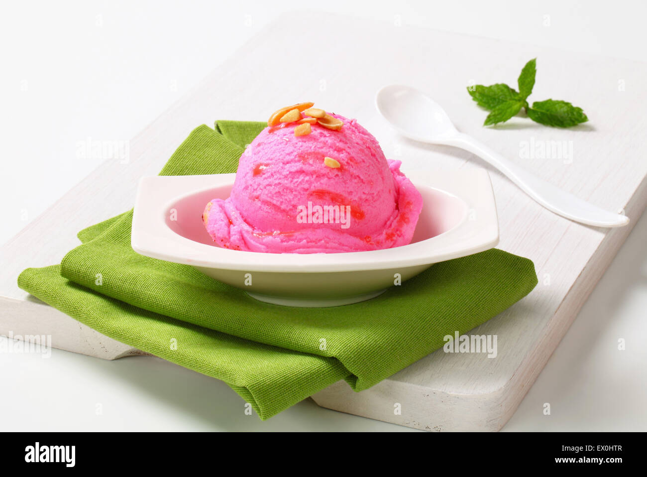 Scoop of pink ice cream in a dessert bowl Stock Photo