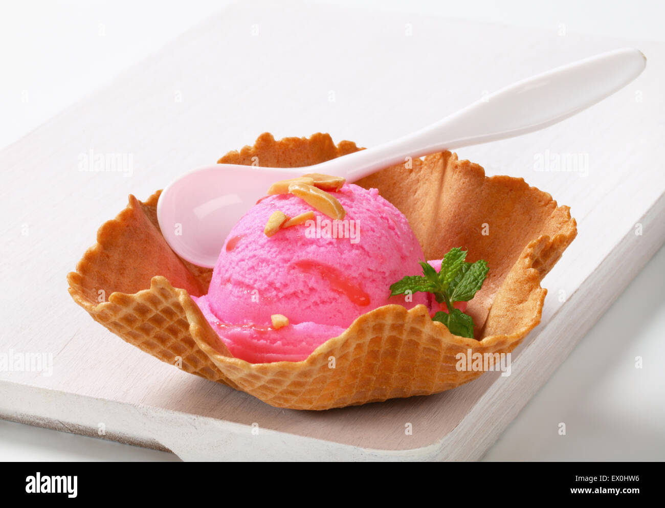 Pink fruit flavored ice cream in a waffle basket Stock Photo