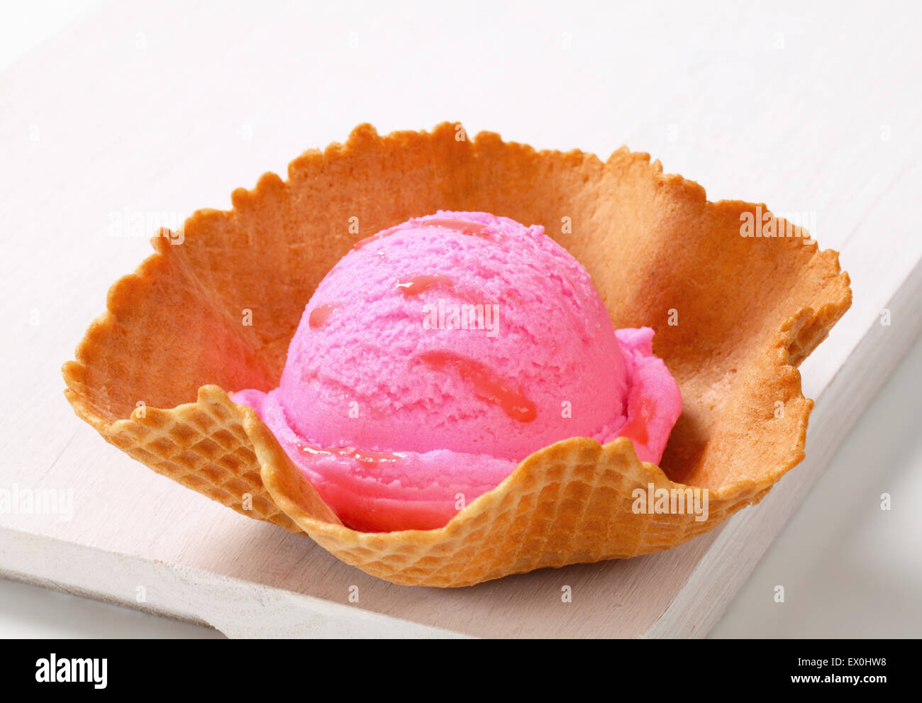 Pink fruit flavored ice cream in a waffle basket Stock Photo