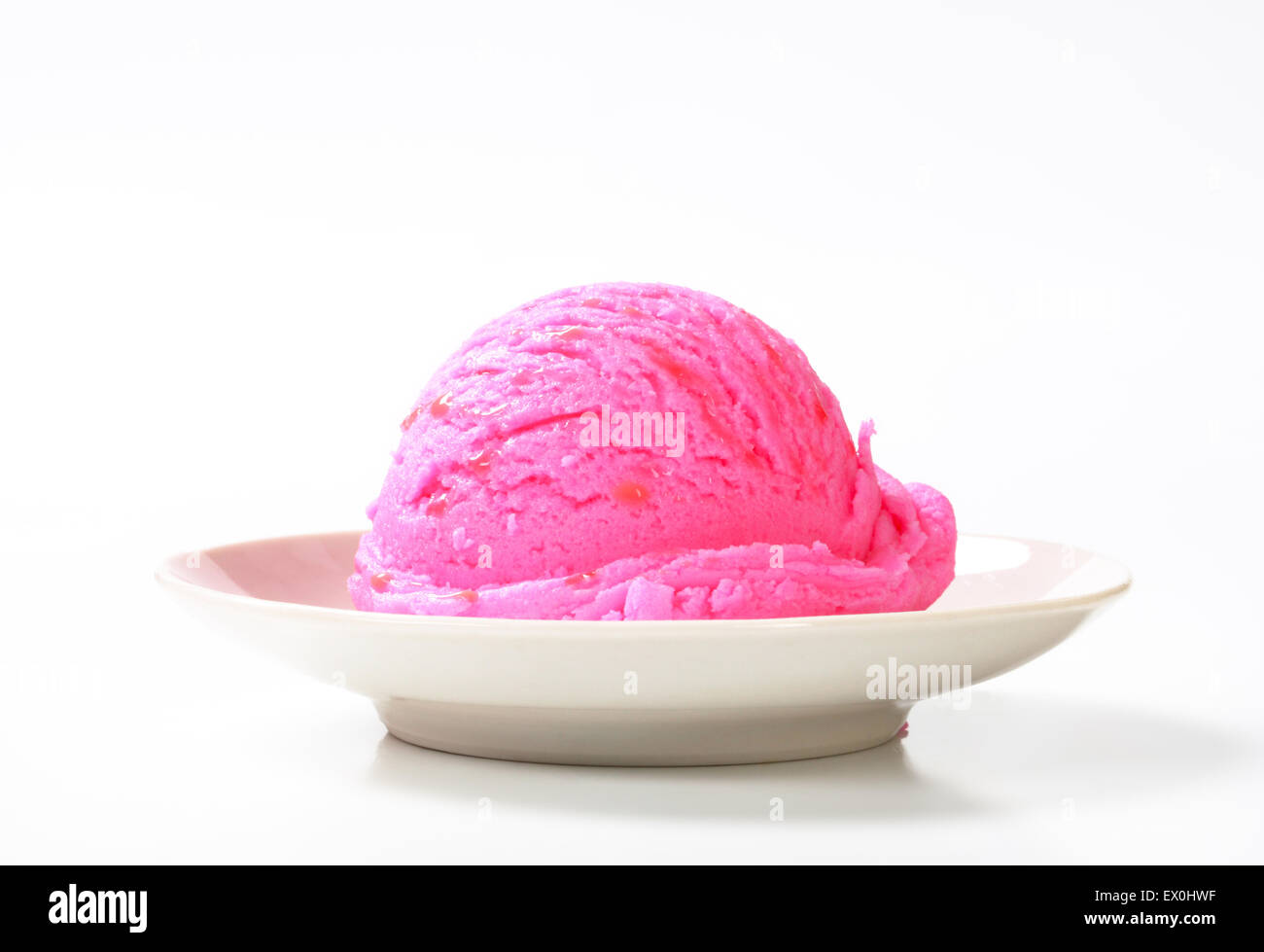 Scoop of pink ice cream on a plate Stock Photo