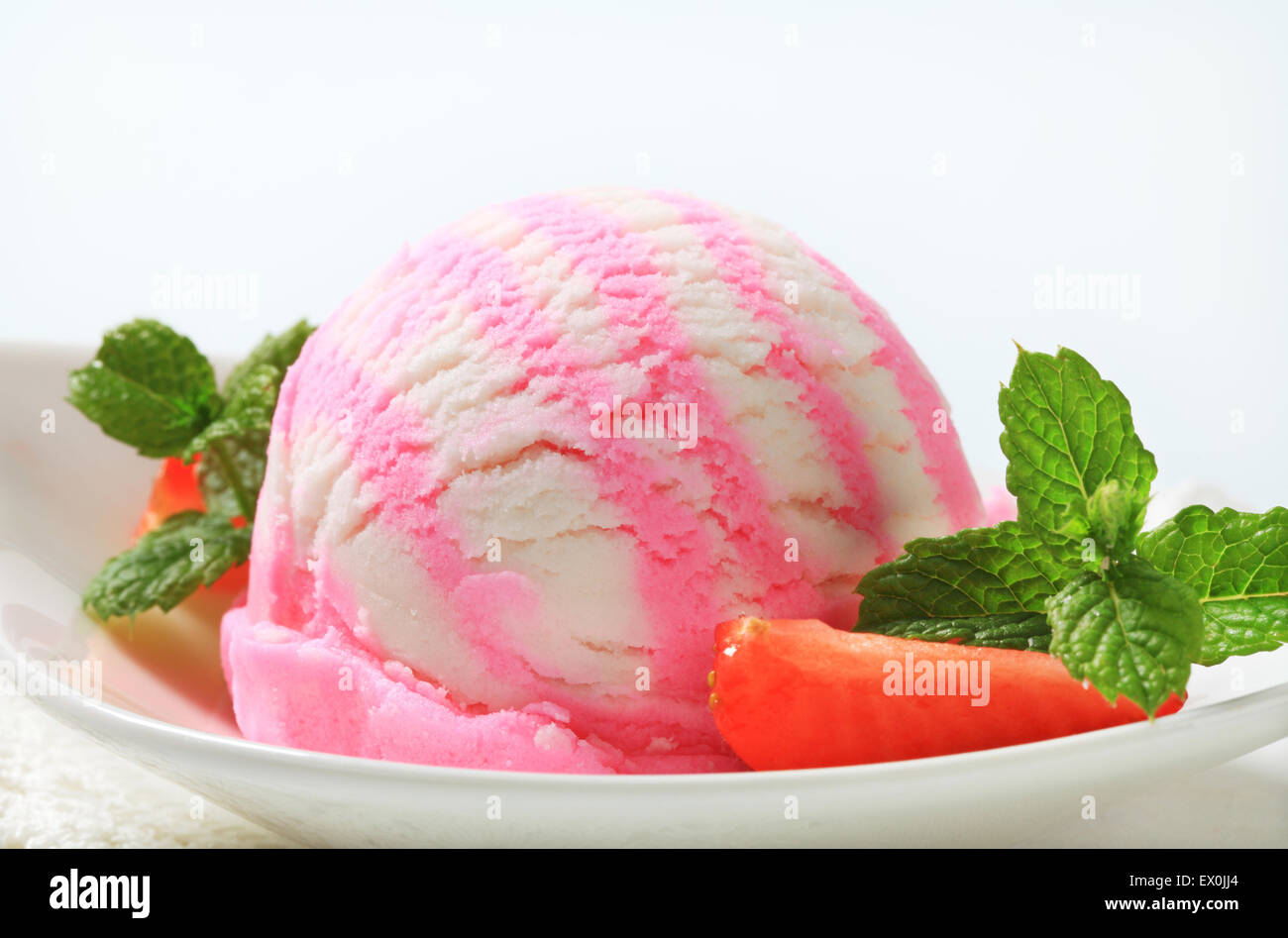 Scoop of ice cream with fresh strawberries Stock Photo