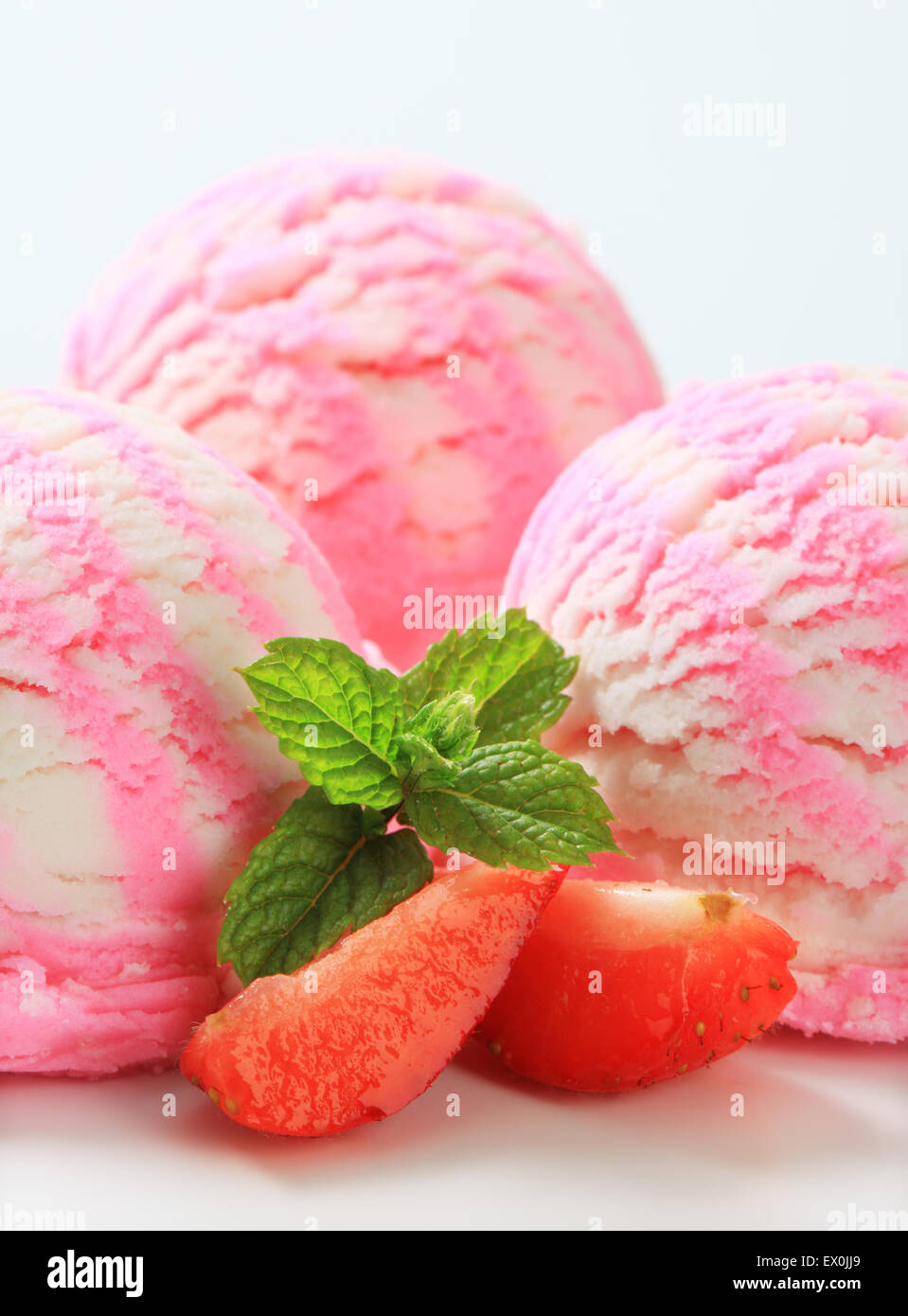 Scoops of ice cream with fresh strawberries Stock Photo